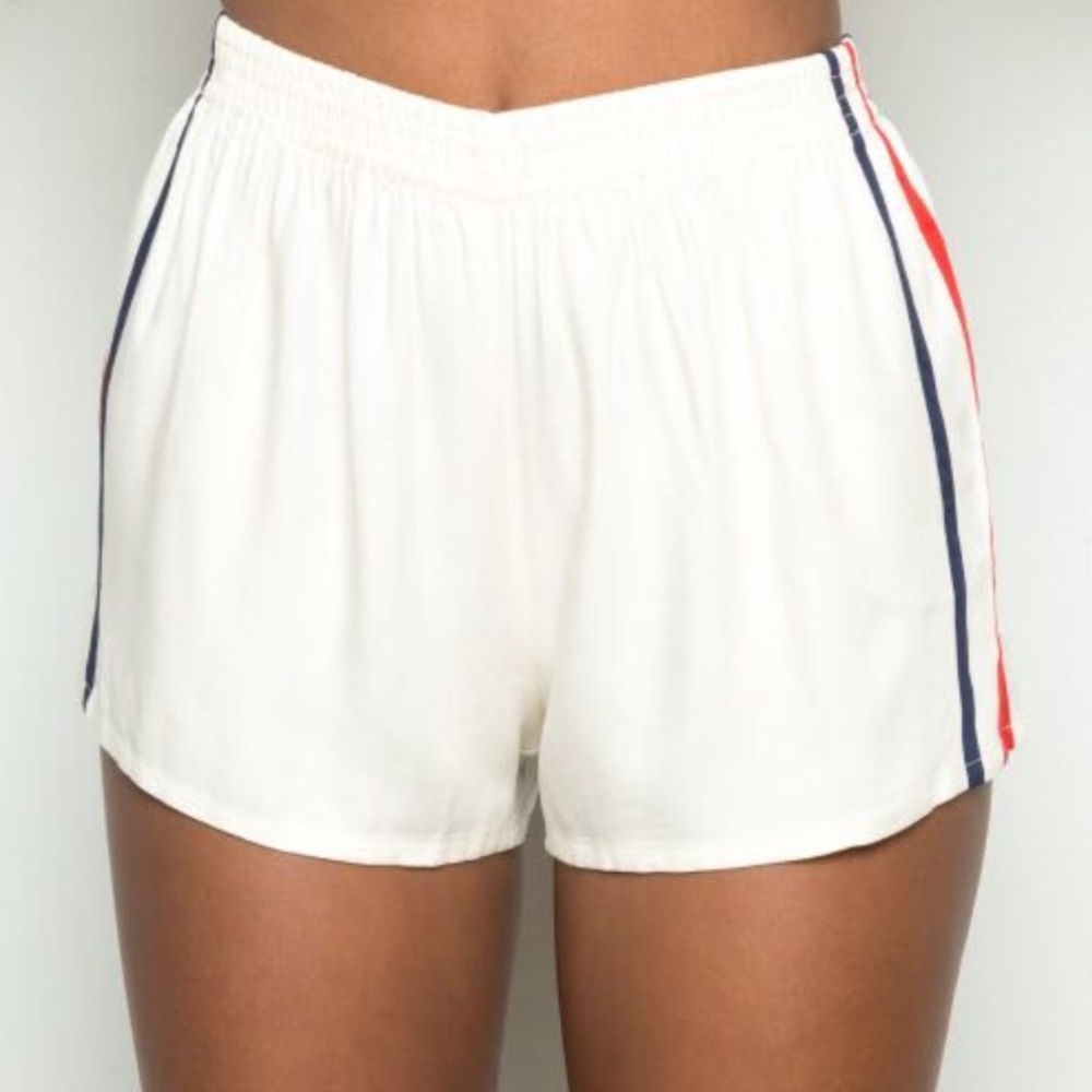 Brandy Melville cream shorts with stripes on side